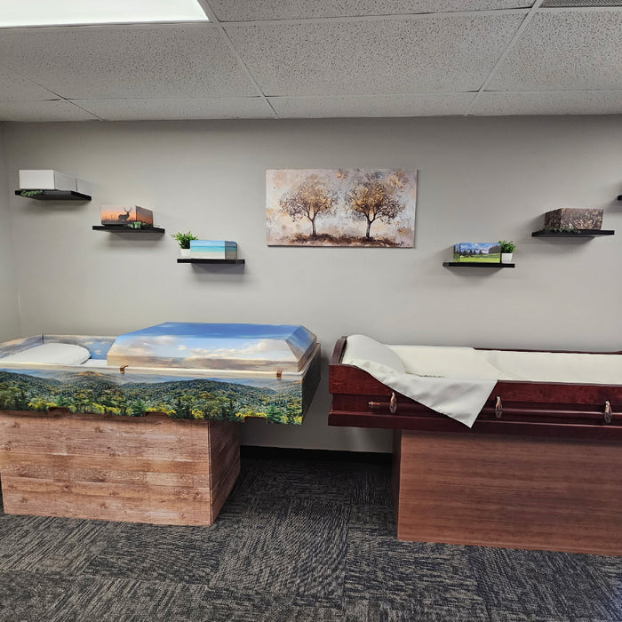 Starmark Southeast showroom with cremation and viewing containers on biers with printed urns on wall displays.