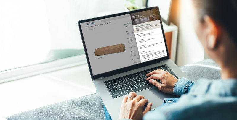 Person using a laptop with a product page displayed on the screen