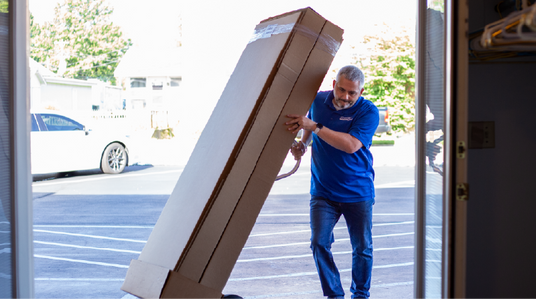 Team member deliverying products into funeral home.