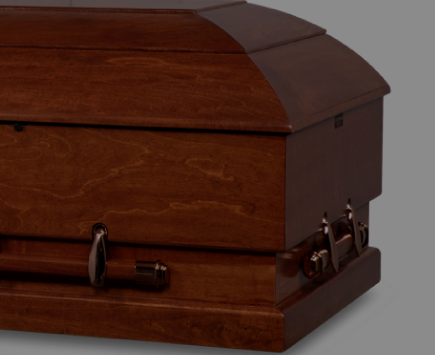 corner view of a wood oversized casket